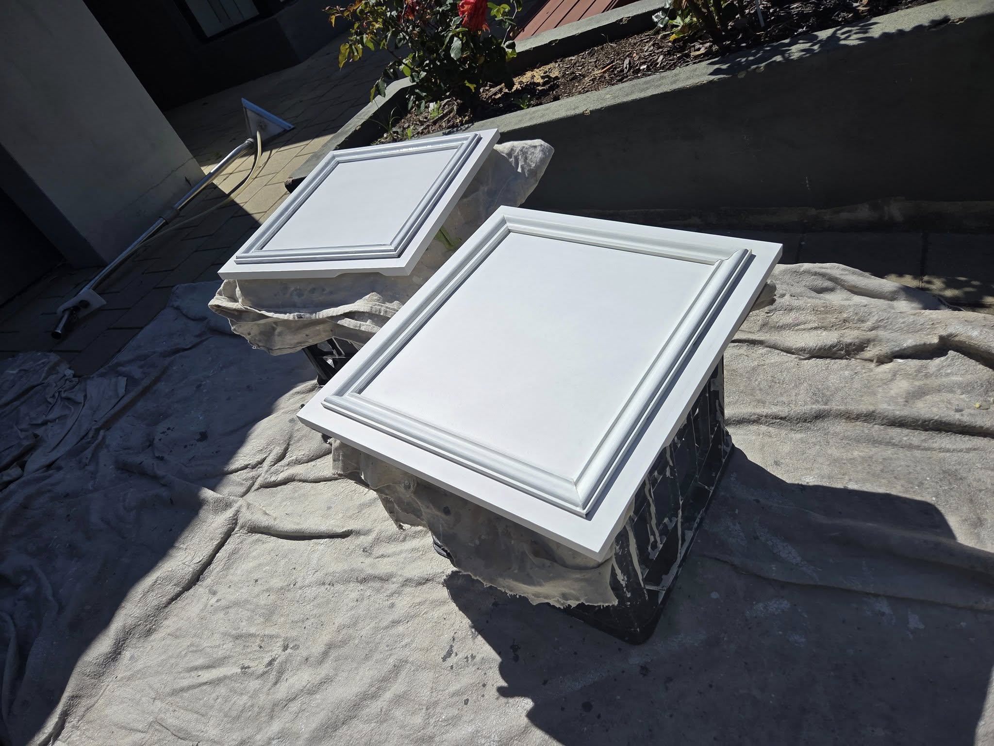 Freshly coated cabinet doors drying outside