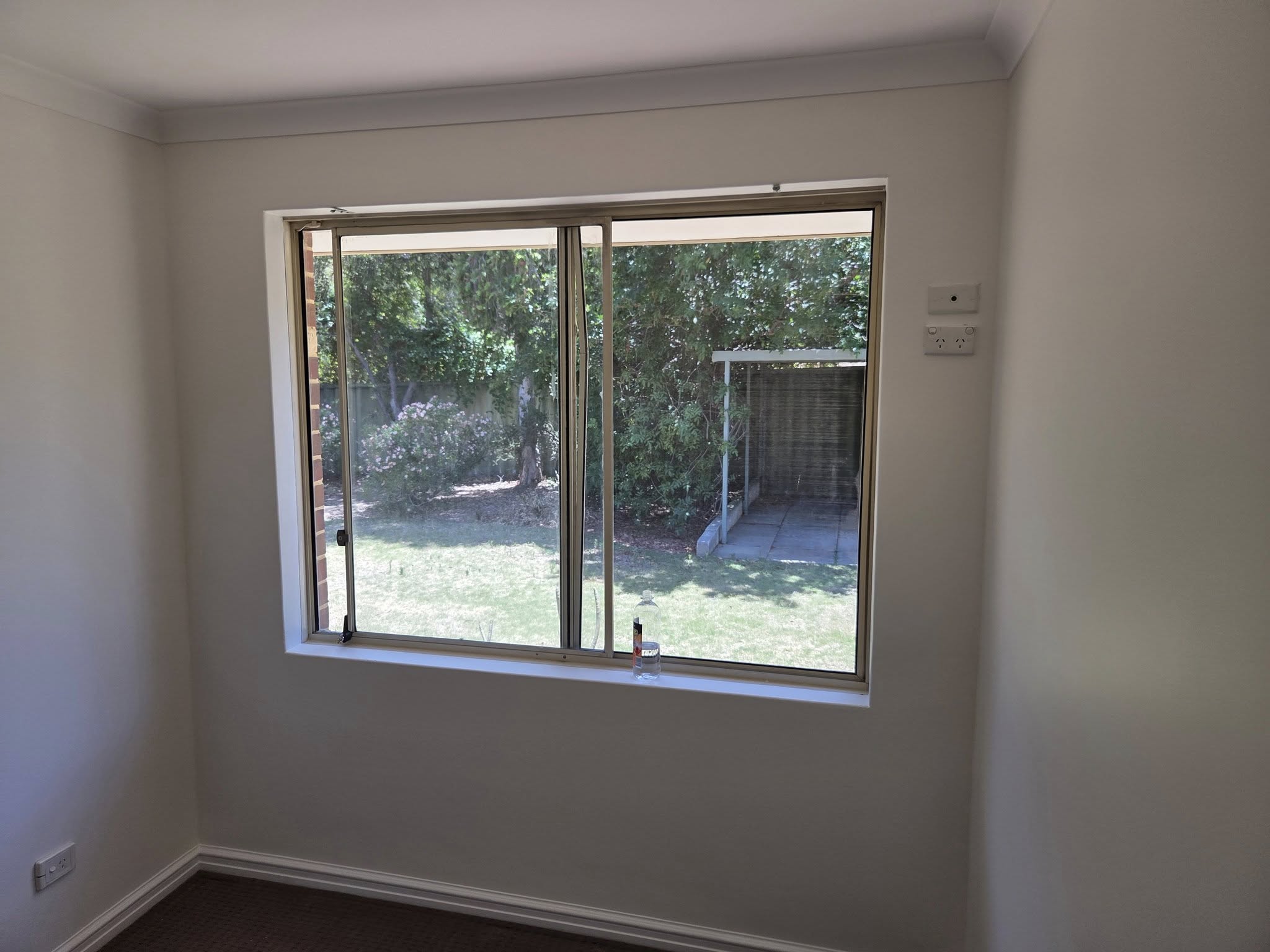 Bright freshly painted room with large window